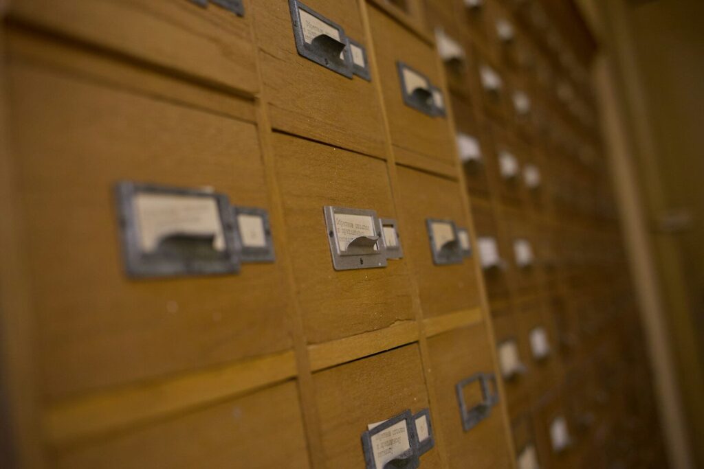Wooden card catalogue drawers with labels